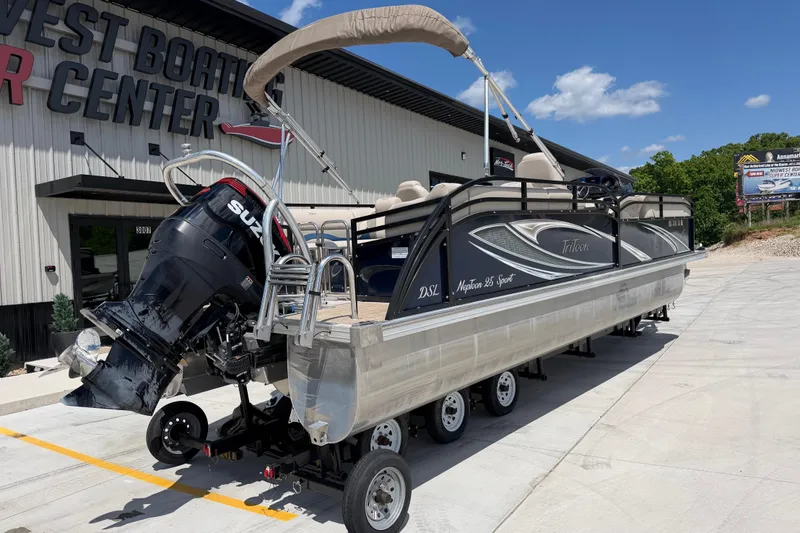 Slide: The Image of 2018 JC 25 Neptoon DSL pontoon boat outside a boating center. - 3