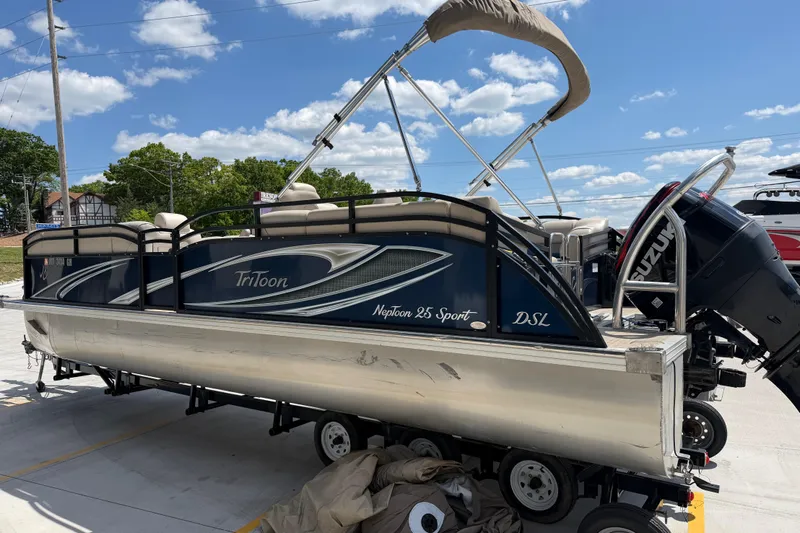Slide: The Image of 2018 JC 25 Neptoon DSL pontoon boat on trailer, blue sky. - 6