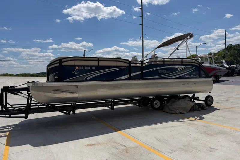Slide: The Image of 2018 JC 25 Neptoon DSL pontoon boat on trailer under clear sky. - 7