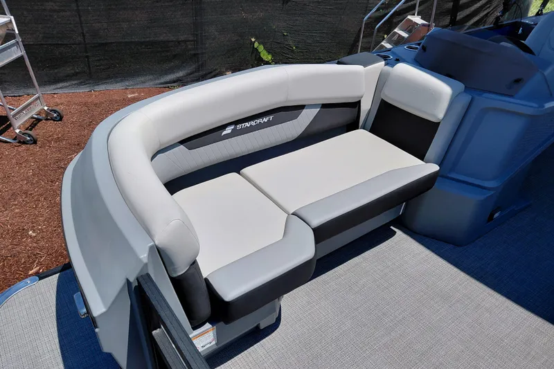 Slide: The Image of 2026 Starcraft VX 22 R DH boat interior with cushioned seating. - 11