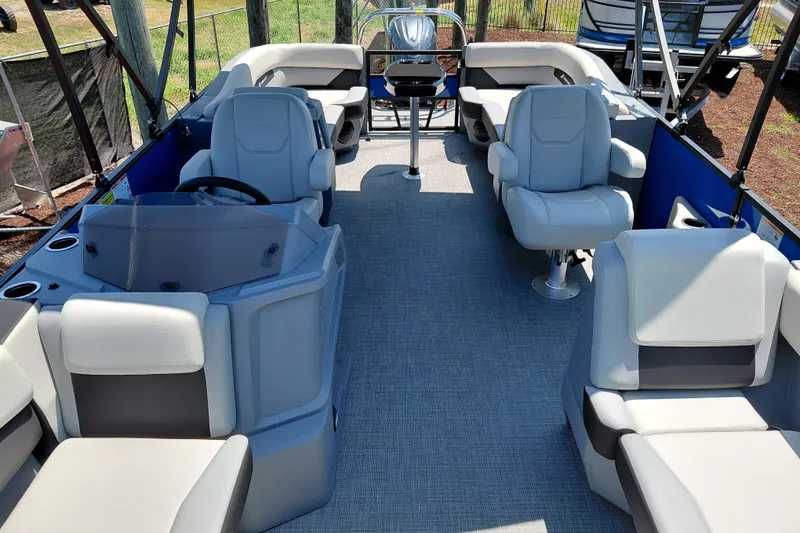 Slide: The Image of 2026 Starcraft VX 22 R DH pontoon boat interior with plush seating and modern helm. - 13