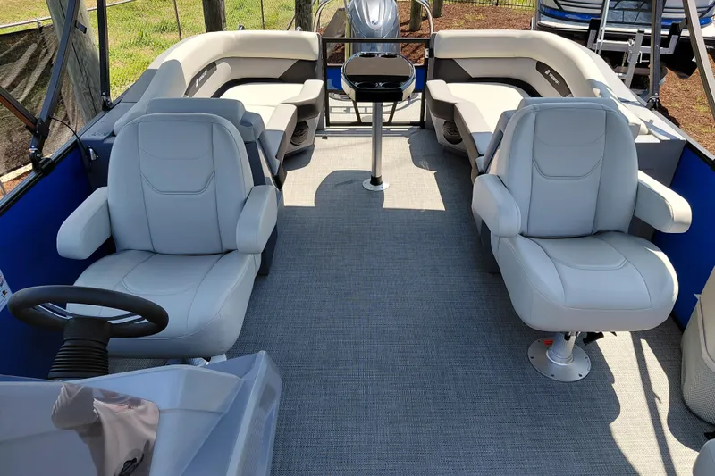 Slide: The Image of 2026 Starcraft VX 22 R DH pontoon boat interior with plush seating and modern design. - 14