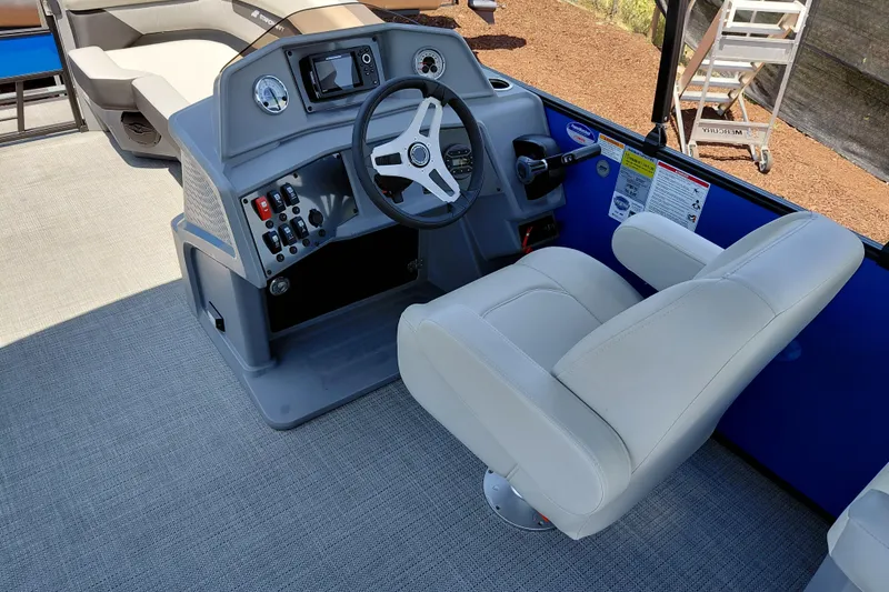 Slide: The Image of Captain's helm of 2026 Starcraft VX 22 R DH pontoon boat with modern controls. - 24