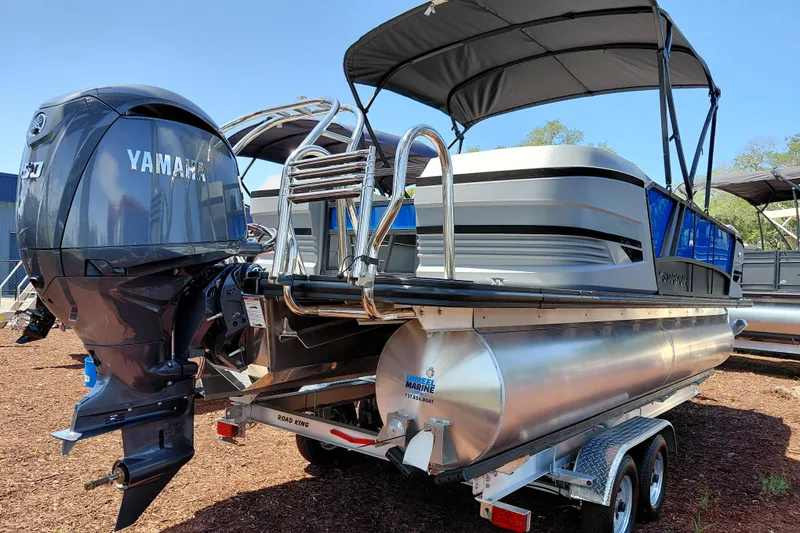 Slide: The Image of 2026 Starcraft VX 22 R DH pontoon boat with Yamaha engine on trailer. - 3