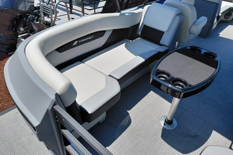 Slide: The Image of Luxurious seating area on 2026 Starcraft VX 22 R DH pontoon boat with table and cup holders. - 31