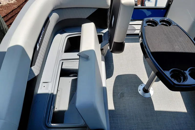 Slide: The Image of Interior of 2026 Starcraft VX 22 R DH boat with seating and table. - 33