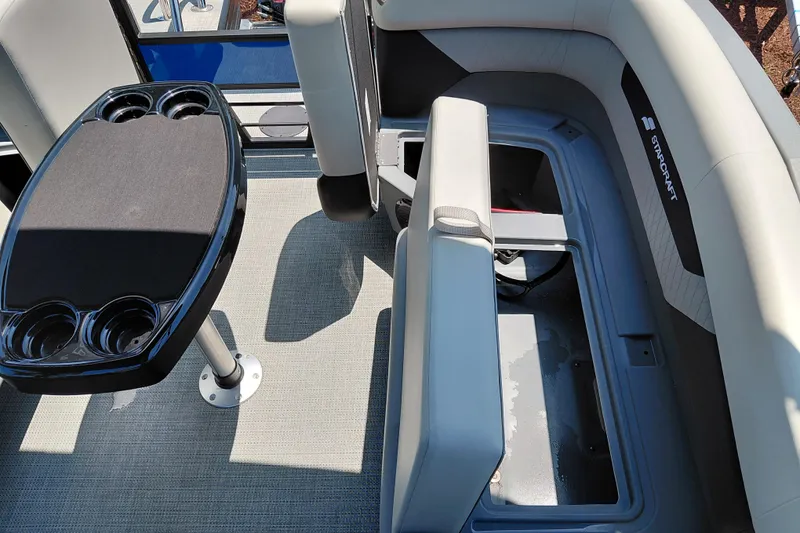 Slide: The Image of Interior of 2026 Starcraft VX 22 R DH boat with seating and cupholder table. - 34