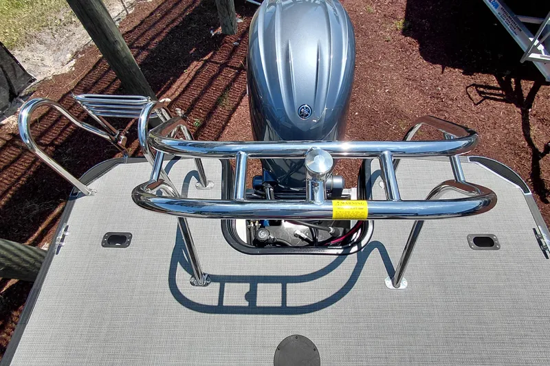 Slide: The Image of 2026 Starcraft VX 22 R DH boat with sleek chrome railing and powerful outboard motor. - 36