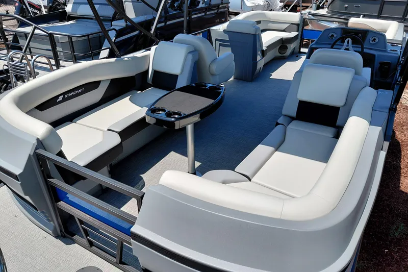 Slide: The Image of 2026 Starcraft VX 22 R DH pontoon boat interior with plush seating and modern design. - 39