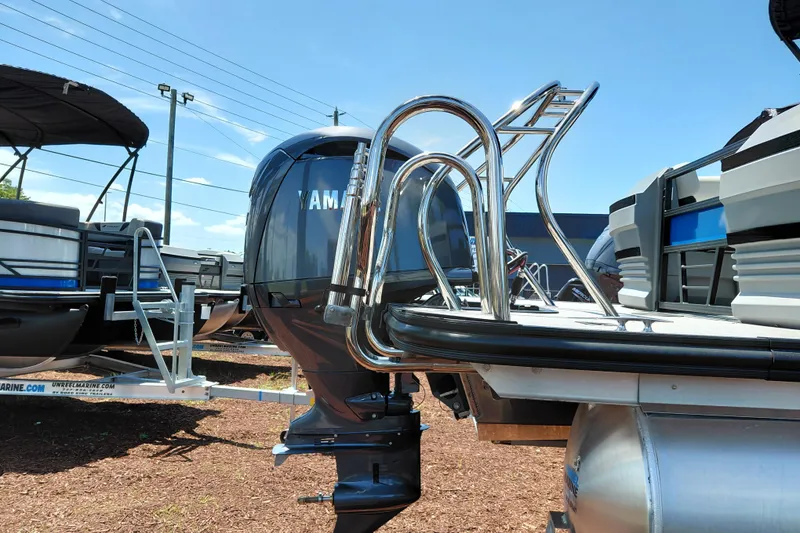 Slide: The Image of 2026 Starcraft VX 22 R DH pontoon boat with Yamaha outboard motor and sleek ladder design. - 4