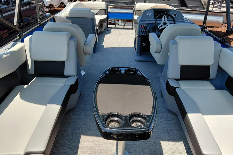 Slide: The Image of 2026 Starcraft VX 22 R DH pontoon boat interior with plush seating and modern helm. - 40