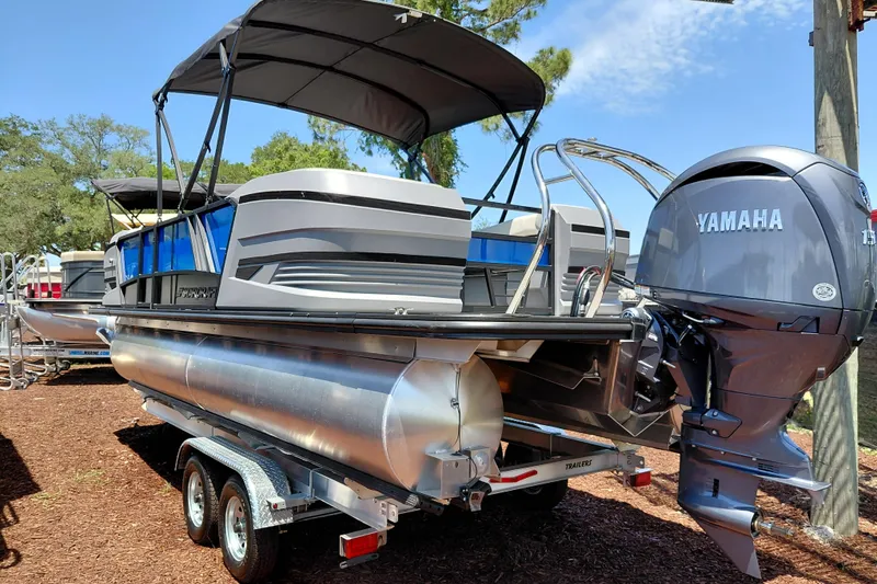 Slide: The Image of 2026 Starcraft VX 22 R DH pontoon boat with Yamaha outboard motor on trailer. - 7