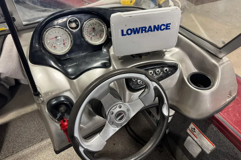 Slide: The Image of 2011 Tracker Targa V-18 Combo dashboard with steering wheel and Lowrance GPS. - 7
