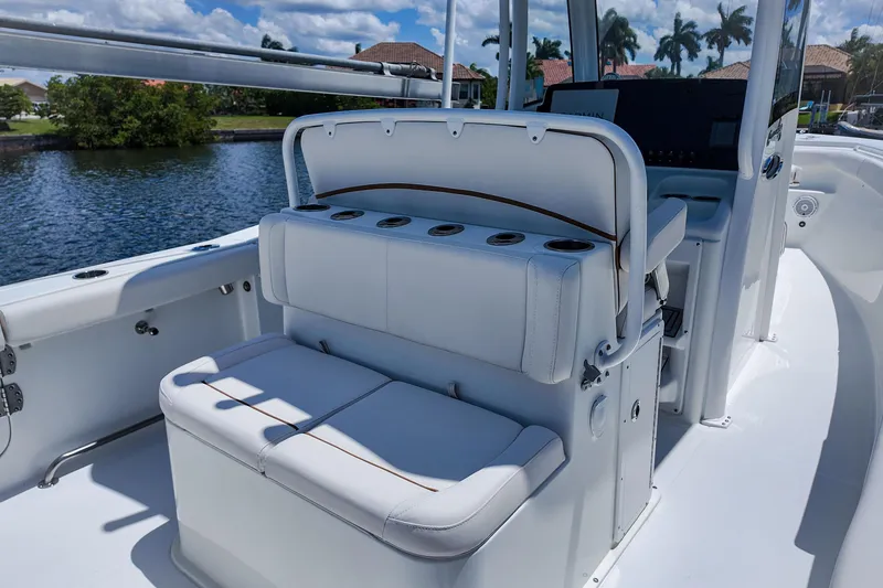 Slide: The Image of 2022 Sea Hunt Gamefish 27 boat interior with seating and rod holders. - 10