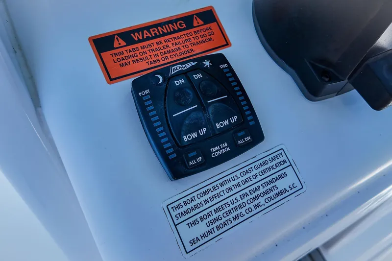 Slide: The Image of Control panel on 2022 Sea Hunt Gamefish 27 boat with warning labels. - 30