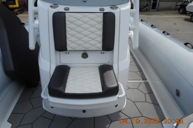 Slide: The Image of 2025 Highfield Sport 760 boat seat with diamond-pattern upholstery and modern design. - 14