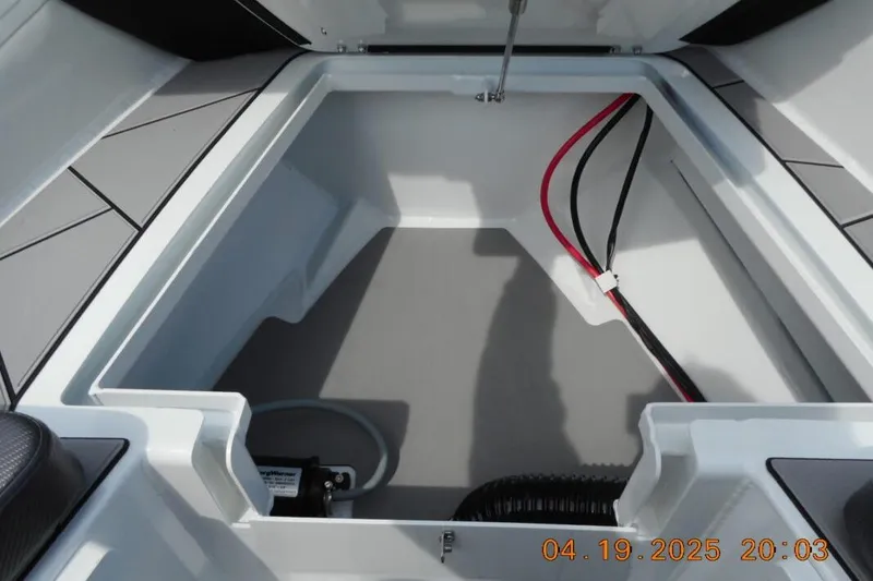 Slide: The Image of Open storage compartment of 2025 Highfield Sport 760 boat, featuring clean interior and wiring. - 15