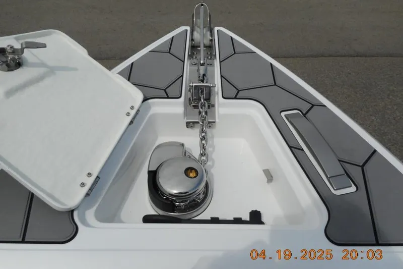 Slide: The Image of Bow anchor compartment of 2025 Highfield Sport 760 boat with chain and winch. - 17