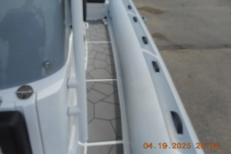 Slide: The Image of 2025 Highfield Sport 760 boat deck with geometric flooring design. - 18