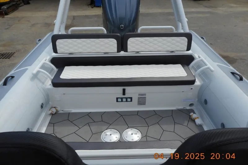 Slide: The Image of Interior of 2025 Highfield Sport 760 boat with cushioned seating. - 19