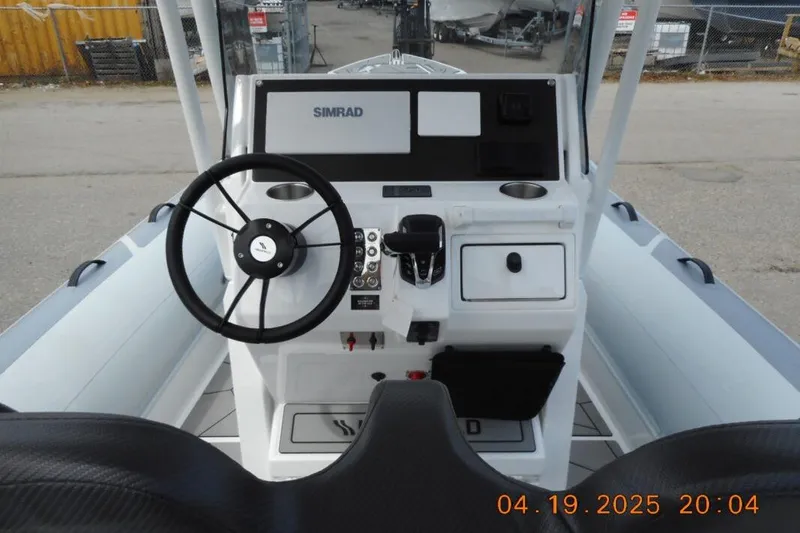 Slide: The Image of Steering console of 2025 Highfield Sport 760 boat with Simrad navigation system. - 20