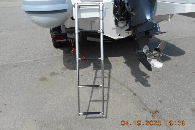 Slide: The Image of Rear view of 2025 Highfield Sport 760 boat with ladder and propeller. - 5