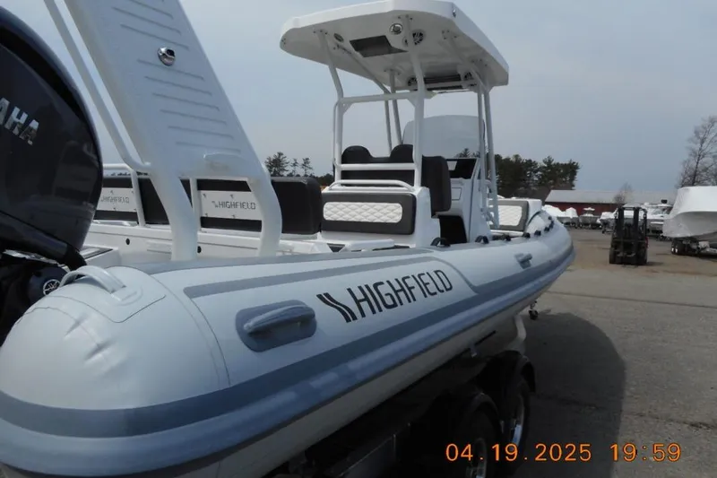 Slide: The Image of 2025 Highfield Sport 760 boat with Yamaha engine, docked outdoors. - 7