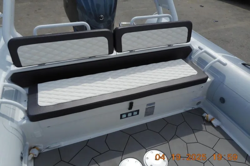 Slide: The Image of 2025 Highfield Sport 760 boat interior with cushioned seating and modern design. - 8