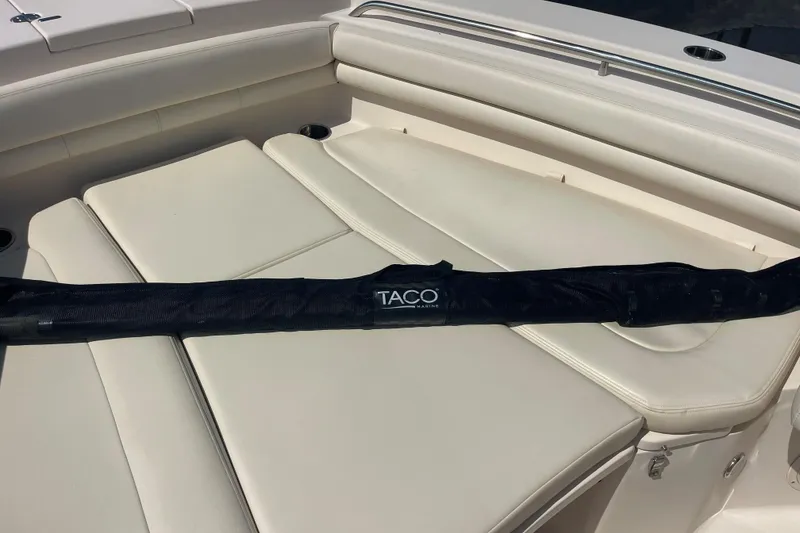 Slide: The Image of 2018 Grady-White Canyon 306 boat with TACO Marine accessory on cushioned seating. - 11