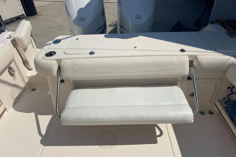 Slide: The Image of 2018 Grady-White Canyon 306 boat with foldable seating and Yamaha V8 engines. - 16