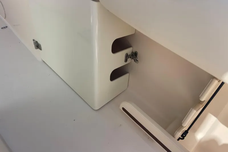 Slide: The Image of 2018 Grady-White Canyon 306 boat interior detail with storage compartment. - 25