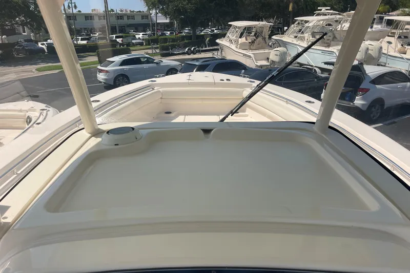 Slide: The Image of 2018 Grady-White Canyon 306 boat deck view in a marina setting. - 26