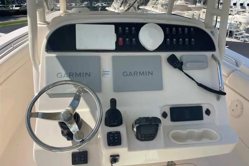 Slide: The Image of 2018 Grady-White Canyon 306 helm with Garmin navigation and control systems. - 6