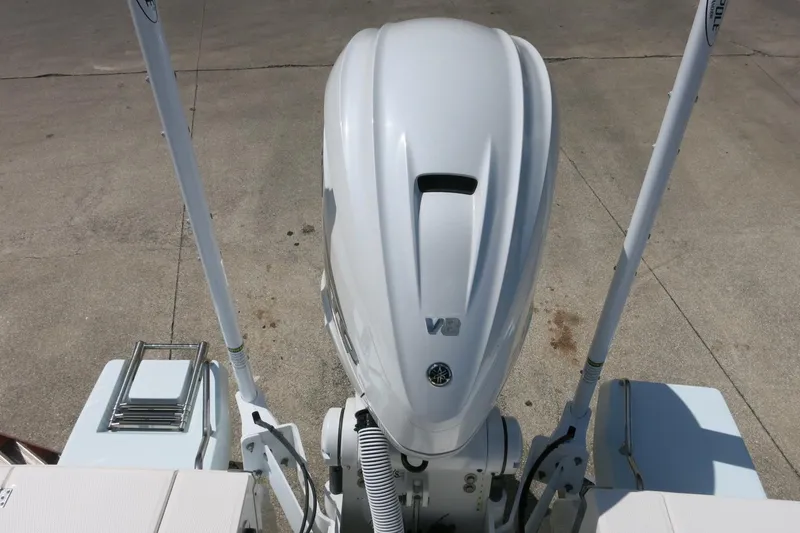 Slide: The Image of 2022 Robalo 266 Cayman boat with V8 engine, viewed from above on concrete surface. - 34