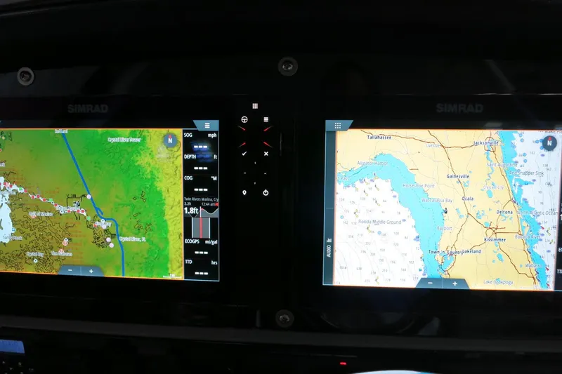 Slide: The Image of Simrad navigation displays on 2022 Robalo 266 Cayman boat dashboard. - 38