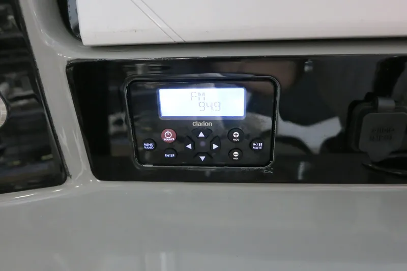 Slide: The Image of Clarion radio display on 2022 Robalo 266 Cayman boat dashboard. - 40