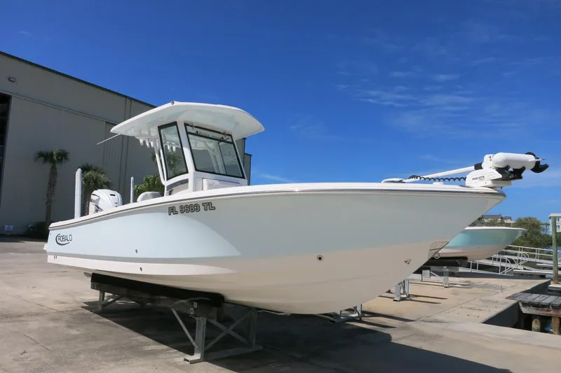 Slide: The Image of 2022 Robalo 266 Cayman boat on display under clear blue sky. - 9