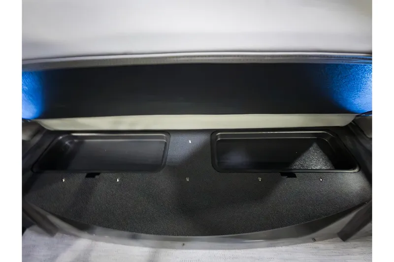 Slide: The Image of Storage compartment of 2026 Godfrey Monaco 235 Single Flip Lounge boat, featuring dual trays. - 26
