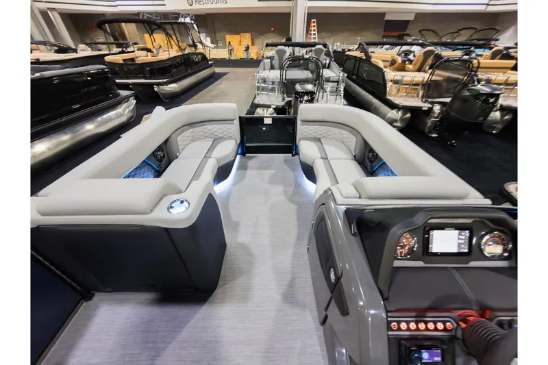 Slide: The Image of 2026 Godfrey Monaco 235 boat interior with luxurious seating and modern dashboard. - 28