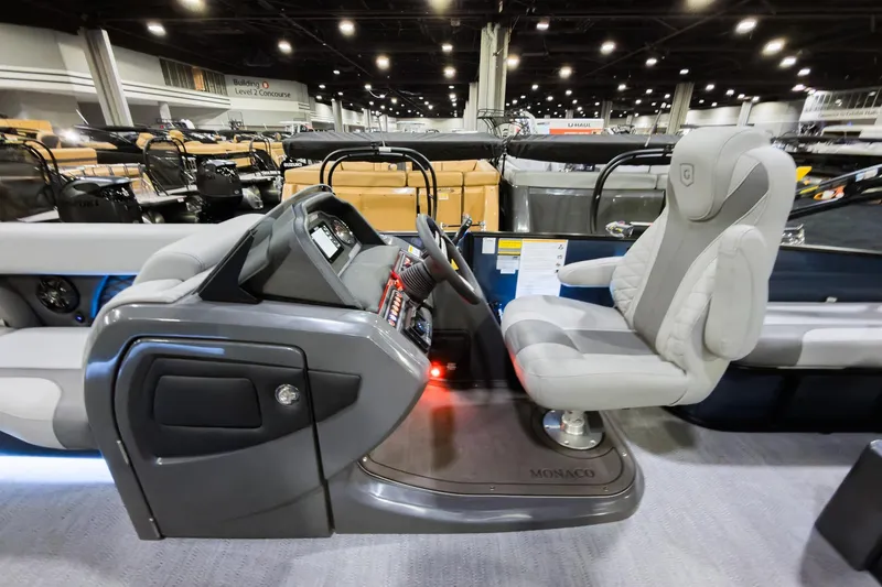 Slide: The Image of 2026 Godfrey Monaco 235 boat interior with modern helm and seating. - 9