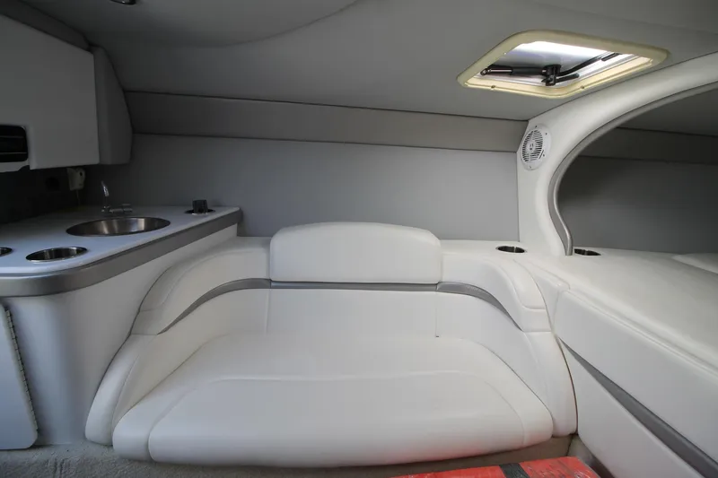 Slide: The Image of Interior of 2006 Formula 292 FASTech boat with white seating and kitchenette. - 13