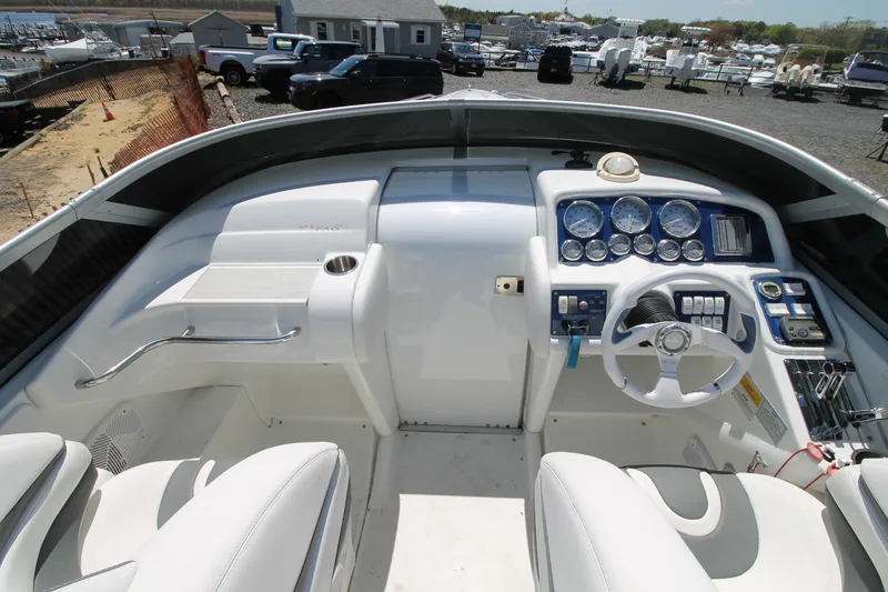 Slide: The Image of 2006 Formula 292 FASTech boat cockpit with steering wheel and instrument panel. - 2