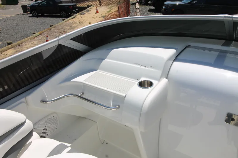Slide: The Image of 2006 Formula 292 FASTech boat interior with cup holder and seating area. - 5