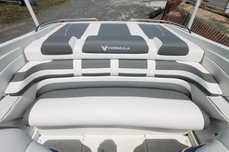 Slide: The Image of 2006 Formula 292 FASTech boat interior with gray and white cushioned seating. - 7