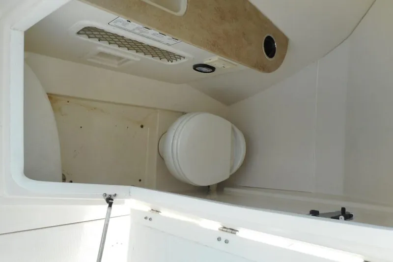 Slide: The Image of Interior view of a 2020 Sailfish 275 DC boat's compact bathroom area. - 11