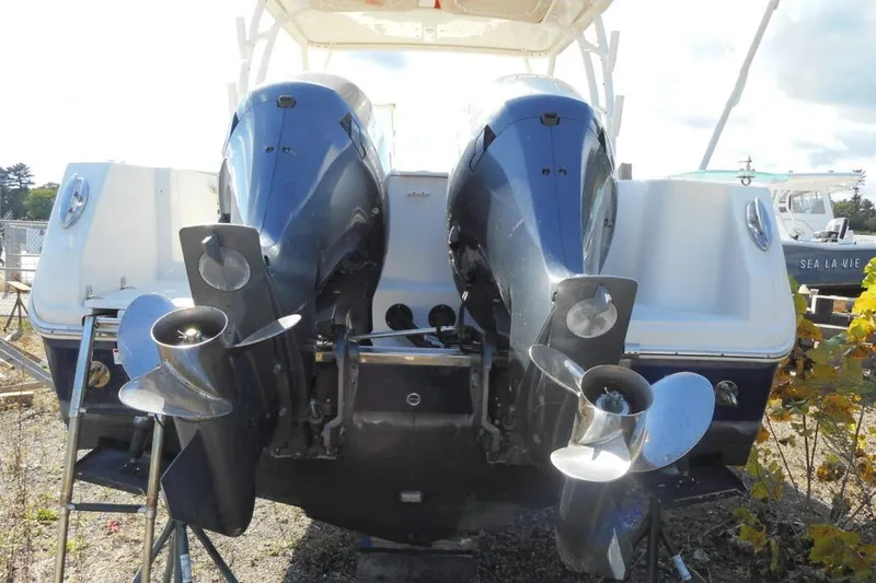 Slide: The Image of 2020 Sailfish 275 DC boat with dual outboard motors, rear view. - 3