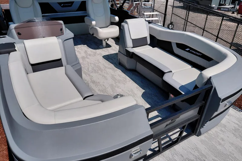 Slide: The Image of 2026 Starcraft VX 24 Q DH pontoon boat interior with luxurious seating and modern design. - 13