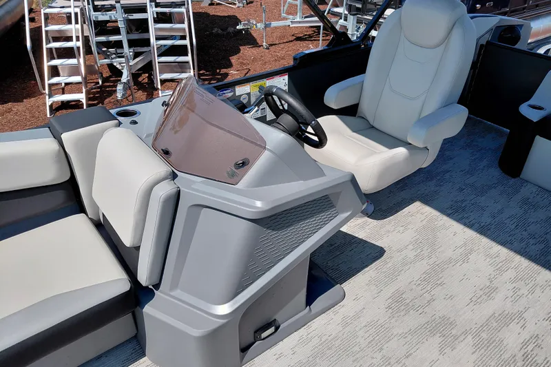 Slide: The Image of 2026 Starcraft VX 24 Q DH boat interior with modern helm and comfortable seating. - 16