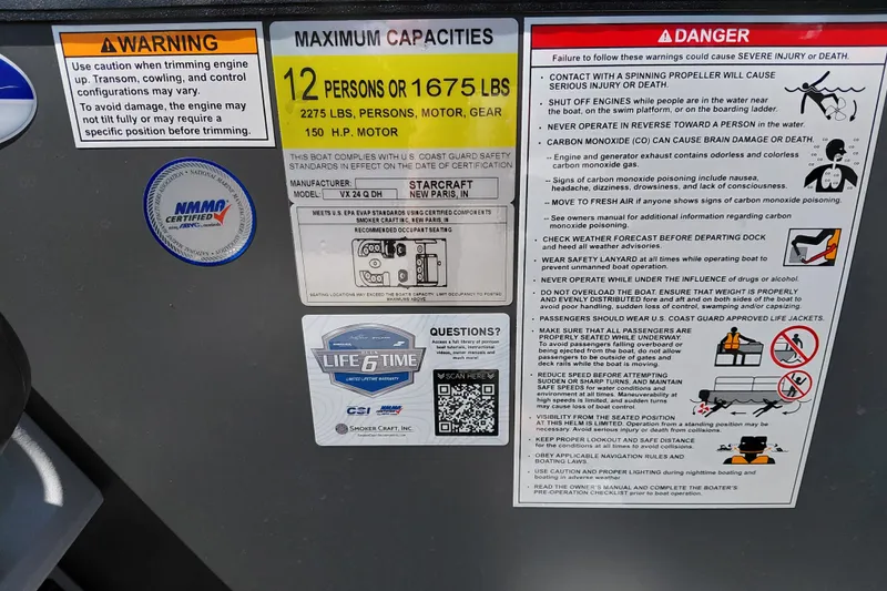 Slide: The Image of Safety and capacity labels on Starcraft VX 24 Q DH boat, 2026 model. - 20