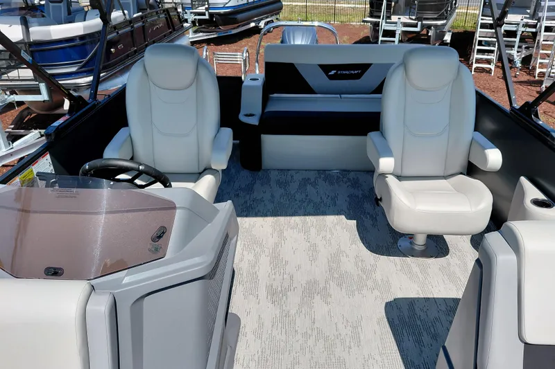 Slide: The Image of Interior of 2026 Starcraft VX 24 Q DH boat with plush seating and modern helm. - 21